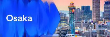 Osaka city skyline with Tsutenkaku Tower at sunset